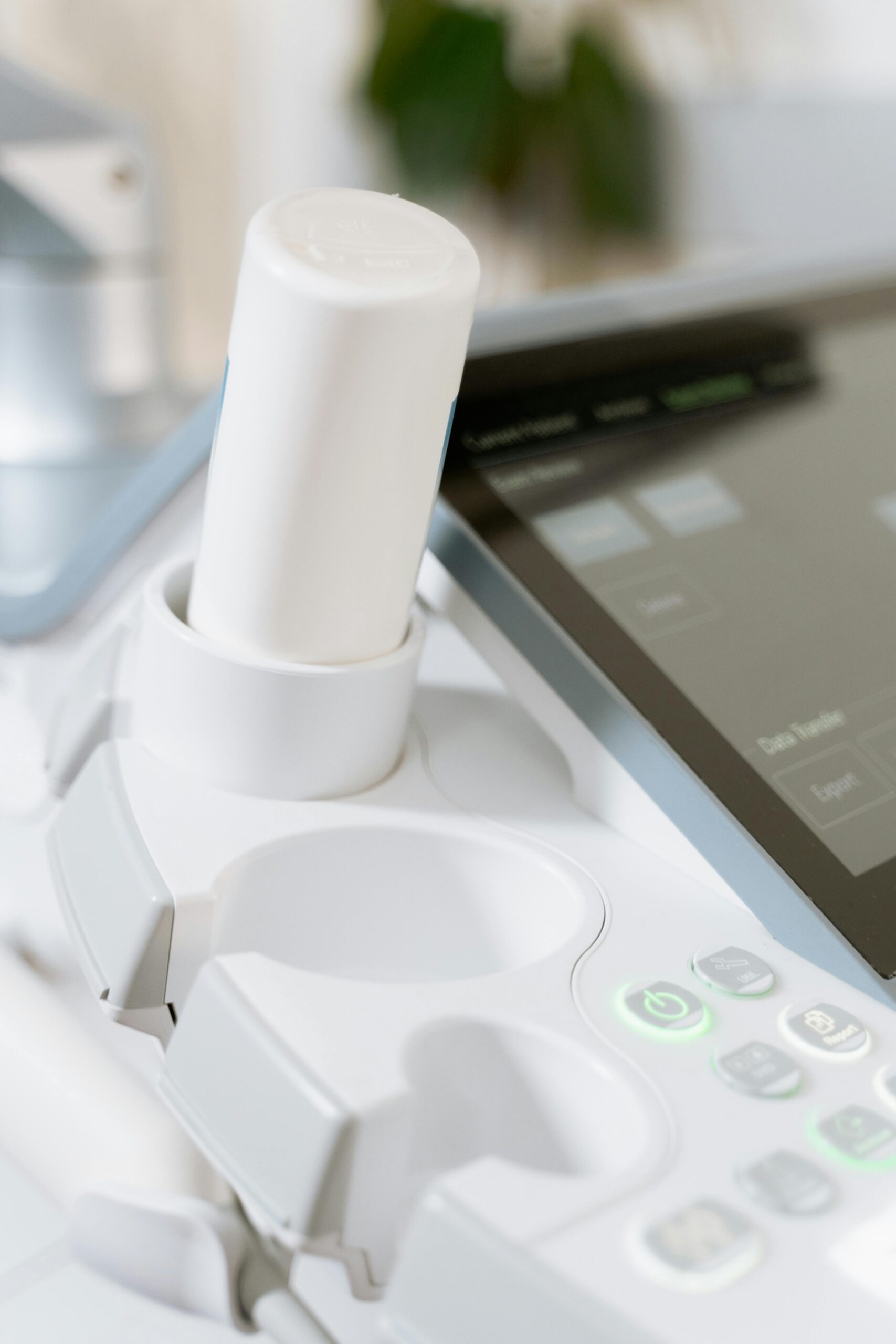 Detailed view of an ultrasound scanner in a healthcare setting.