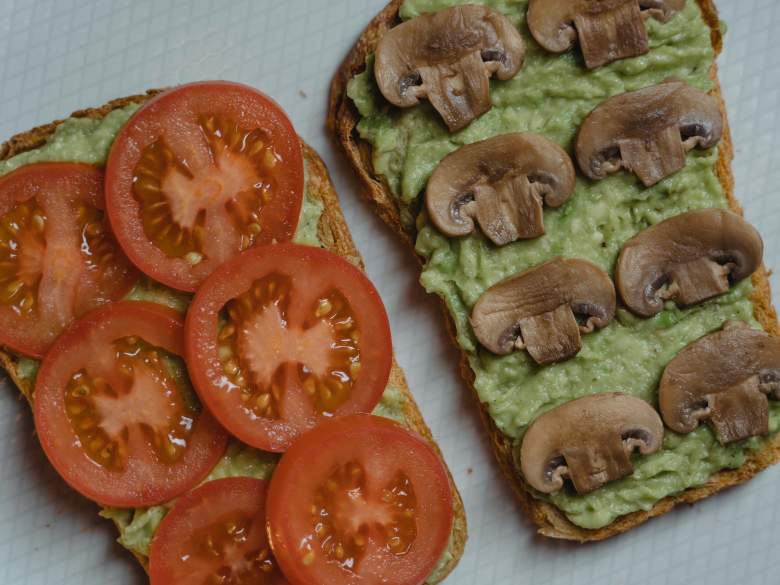 Close-up of almond flour bread with seeds and nuts around it.